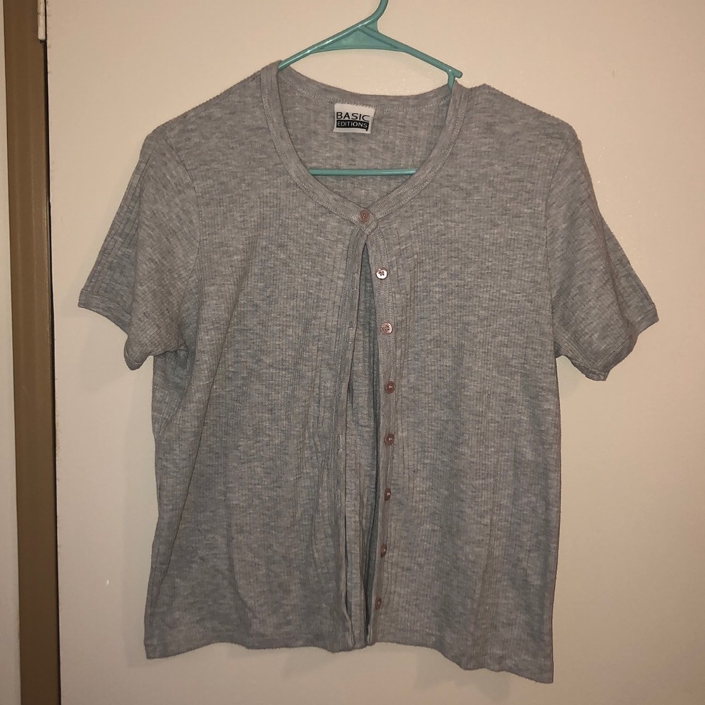 Light grey button up sweater. Buttons r baby pink